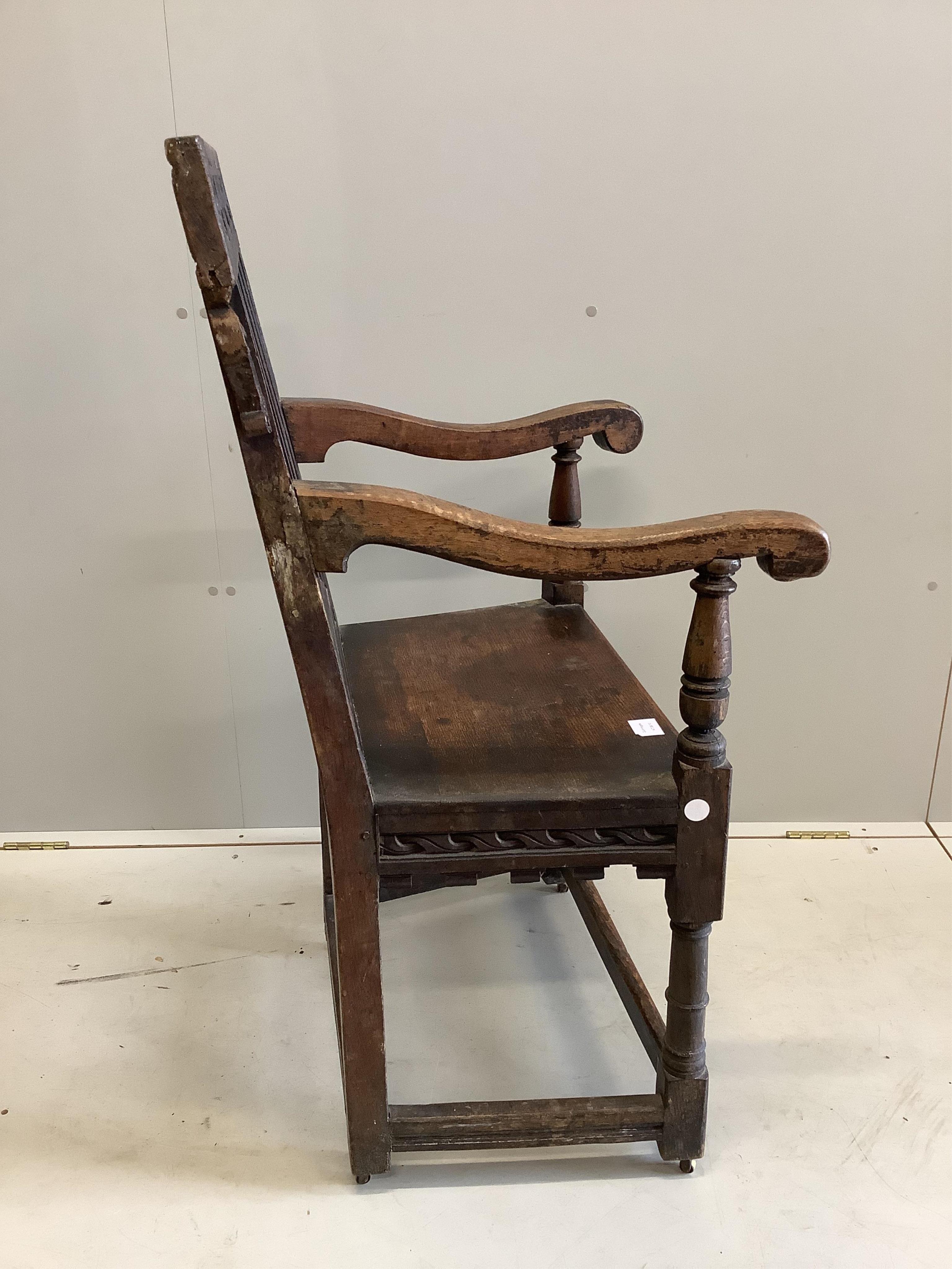 A 17th century oak wainscot type chair, width 61cm, depth 49cm, height 110cm. Condition - fair